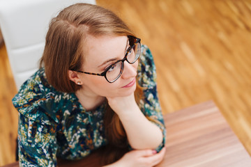 Thoughtful attractive young woman