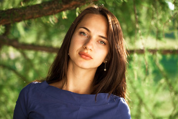 Young beautiful woman in blue dress