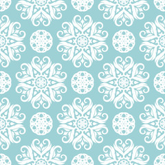 Floral seamless background. White pattern on blue backdrop