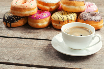 Glazed donuts on wooden background