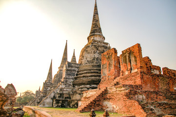 Ruin of Wat Mahathat in Ayutthaya, Thailand. Landmark Historical temple in Thailand with sunset twilight.