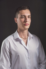 Obraz premium Beautiful fashion man in a suit and a butterfly