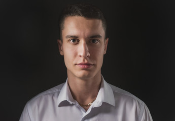 Beautiful fashion man in a suit and a butterfly