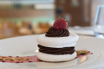Selection of desserts, in a restaurant setting, with blurred background