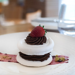 Selection of desserts, in a restaurant setting, with blurred background