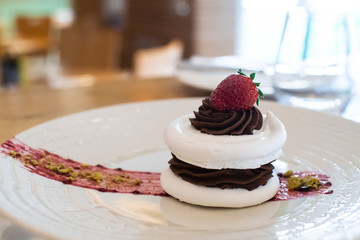 Selection of desserts, in a restaurant setting, with blurred background