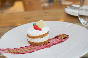Selection of desserts, in a restaurant setting, with blurred background