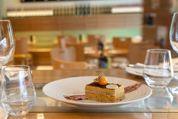 Selection of desserts, in a restaurant setting, with blurred background