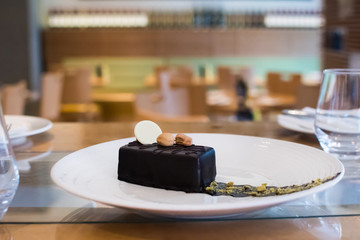 Selection of desserts, in a restaurant setting, with blurred background