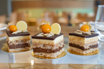 Selection of desserts, in a restaurant setting, with blurred background
