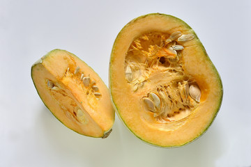 Sliced pumpkin on a light background.