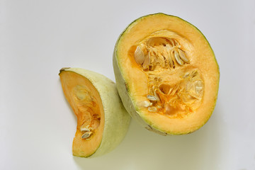 Sliced pumpkin on a light background.