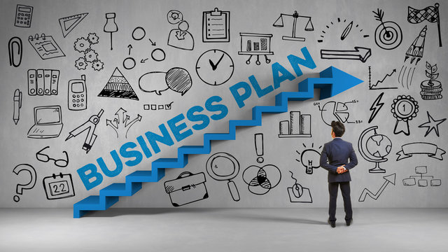 Business plan concept with businessman and stairs