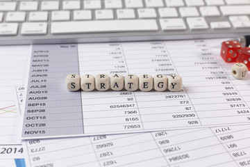 Fototapeta premium The strategy word on wood cube business content image.