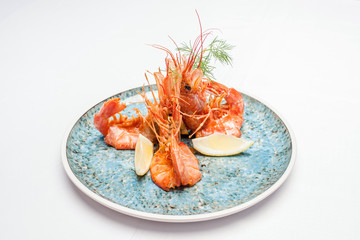 Shrimps on a plate on a white background