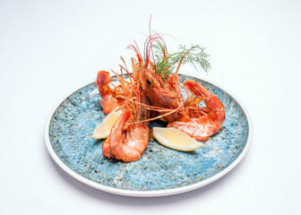 Shrimps on a plate on a white background