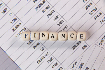The finance word on wood cube business content image.