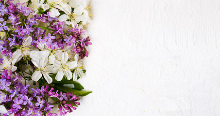 Fototapeta na wymiar Lilac and spring blossom flowers arrangement