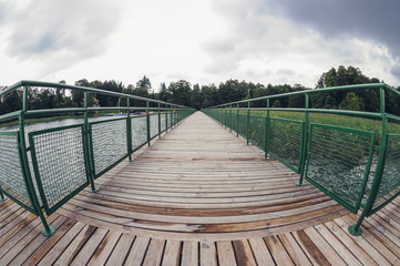 Wooden pier on Lanskie Lake located in Olsztyn Lake District, near the village of Lansk in Warmian-Masurian Voivodeship of Poland