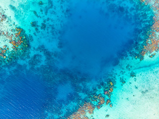 Fototapeta na wymiar Aerial top down coral reef tropical caribbean sea, turquoise blue water. Indonesia Banyak Islands Sumatra, tourist diving travel destination.