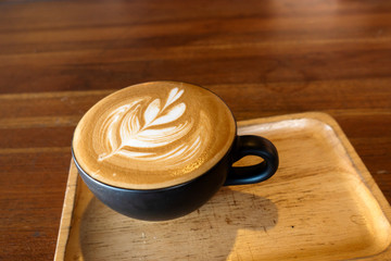 Latte coffee on a wooden table