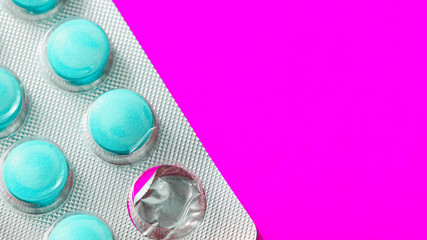 Pills in blister closeup. pink tone. macro shot