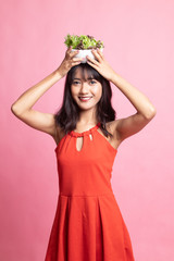 Healthy Asian woman with salad.