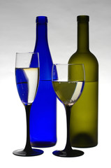 Wine in bottles and in glasses on a white background.