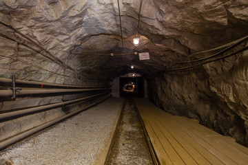 Fototapeta na wymiar Undeground gold mine tunnel drift with rails