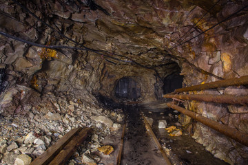 UUndeground gold mine tunnel drift with rails
