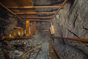Undeground gold mine tunnel drift with rails