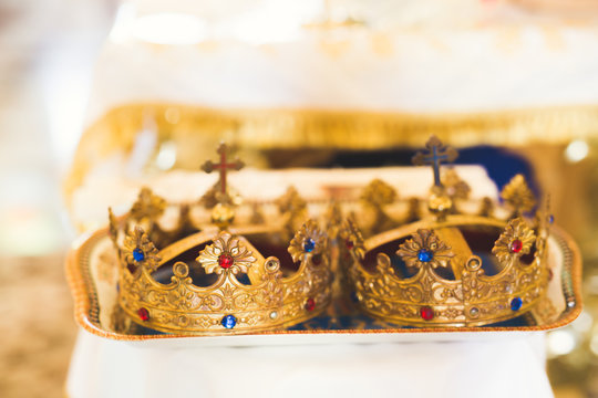 Golden crowns lying on the table in church