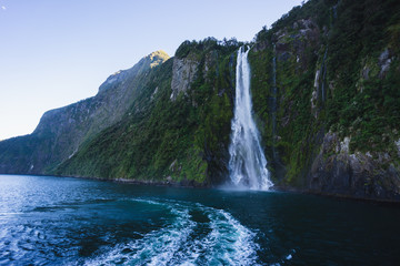Fototapeta na wymiar Milford Sound Waterfall on side of Fiord