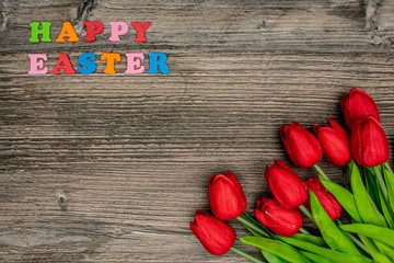 Beautiful tulips on wooden background