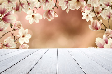 Wooden desk of free space and spring flowers 