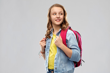education, school and people concept - happy smiling teenage student girl with bag over grey background