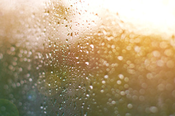 aurora through a window, water drops on glass