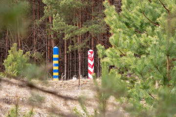 Border pillars on the line between Ukraine and Poland, selective focus. The external border of the European Union. The protection of the state from the threat of smuggling and illegal migration