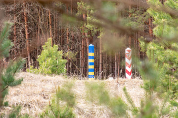 Border pillars on the line between Ukraine and Poland, selective focus. The external border of the European Union. The protection of the state from the threat of smuggling and illegal migration
