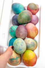 Easter painted eggs folded in plastic container