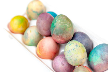Easter painted eggs folded in plastic container