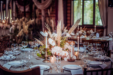 rustic wedding decorations with flowers and candles. banquet decor. picture with soft focus