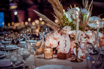 rustic wedding decorations with flowers and candles. banquet decor. picture with soft focus