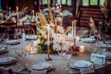 rustic wedding decorations with flowers and candles. banquet decor. picture with soft focus
