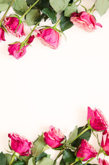 Flowers composition. Frame made of rose flowers on white background. Flat lay, top view, copy space. - Image