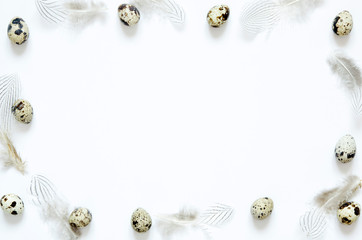 Frame with easter eggs and feathers. Happy Easter concept.