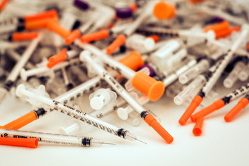 Pile of medical syringes for insulin for diabetes .