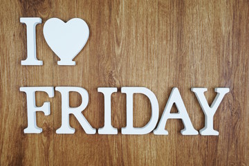Top view of I Love Friday Letters on wooden background