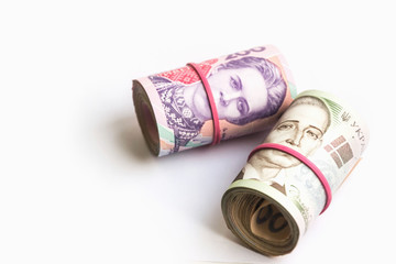 Ukrainian hryvnia banknotes two and five hundred in tubes. Corruption symbol