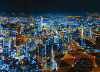 Digital network connection lines of Kuala Lumpur Downtown, Malaysia. Financial district and business centers in smart city in technology concept. Skyscraper and high-rise buildings at night